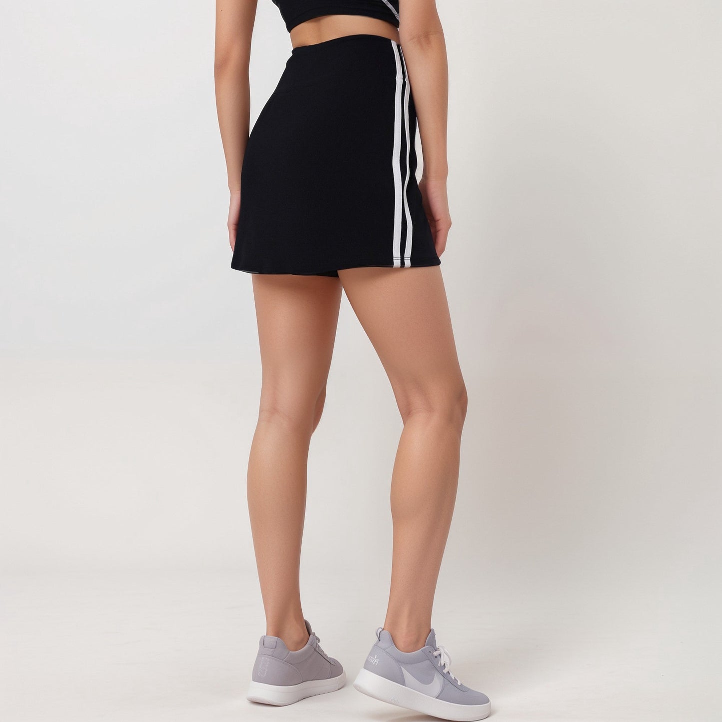 Active Women's Athletic Mini Skirt with Contrast Side Stripes and Built-In Shorts for Support