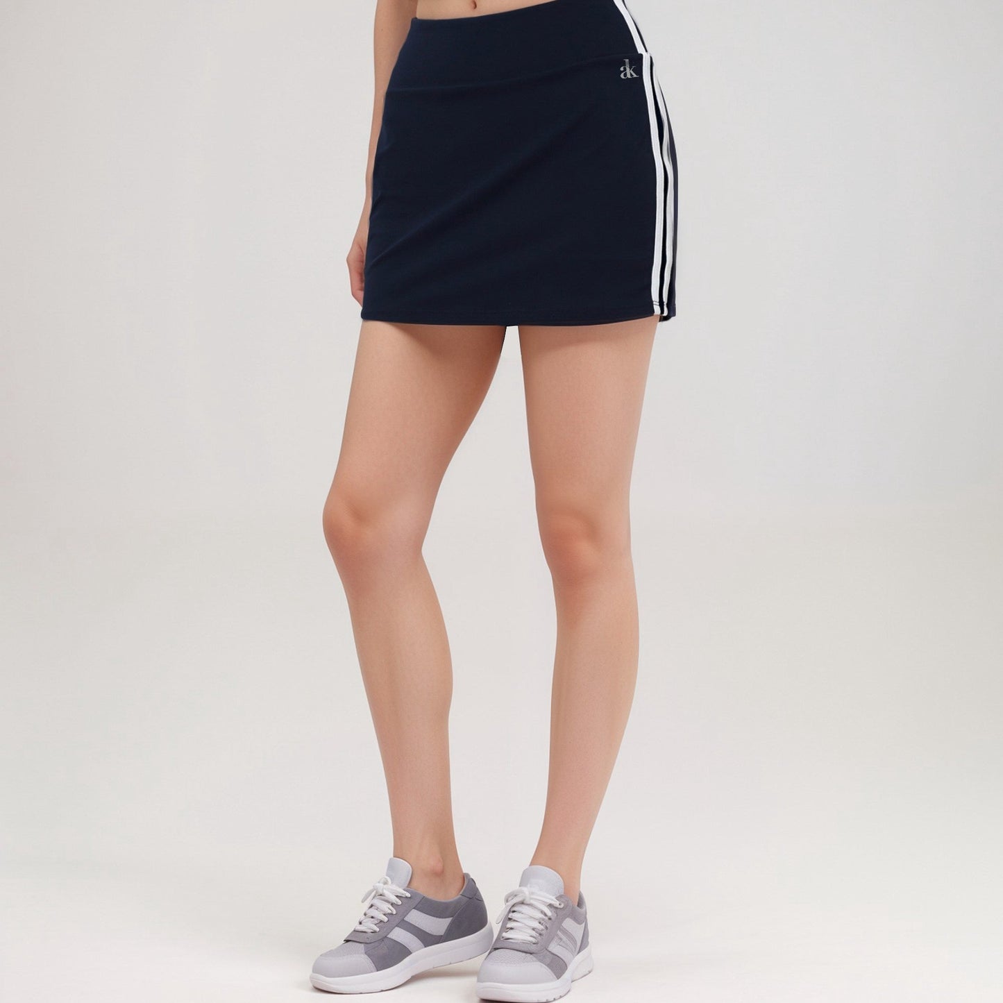 Active Women's Athletic Mini Skirt with Contrast Side Stripes and Built-In Shorts for Support