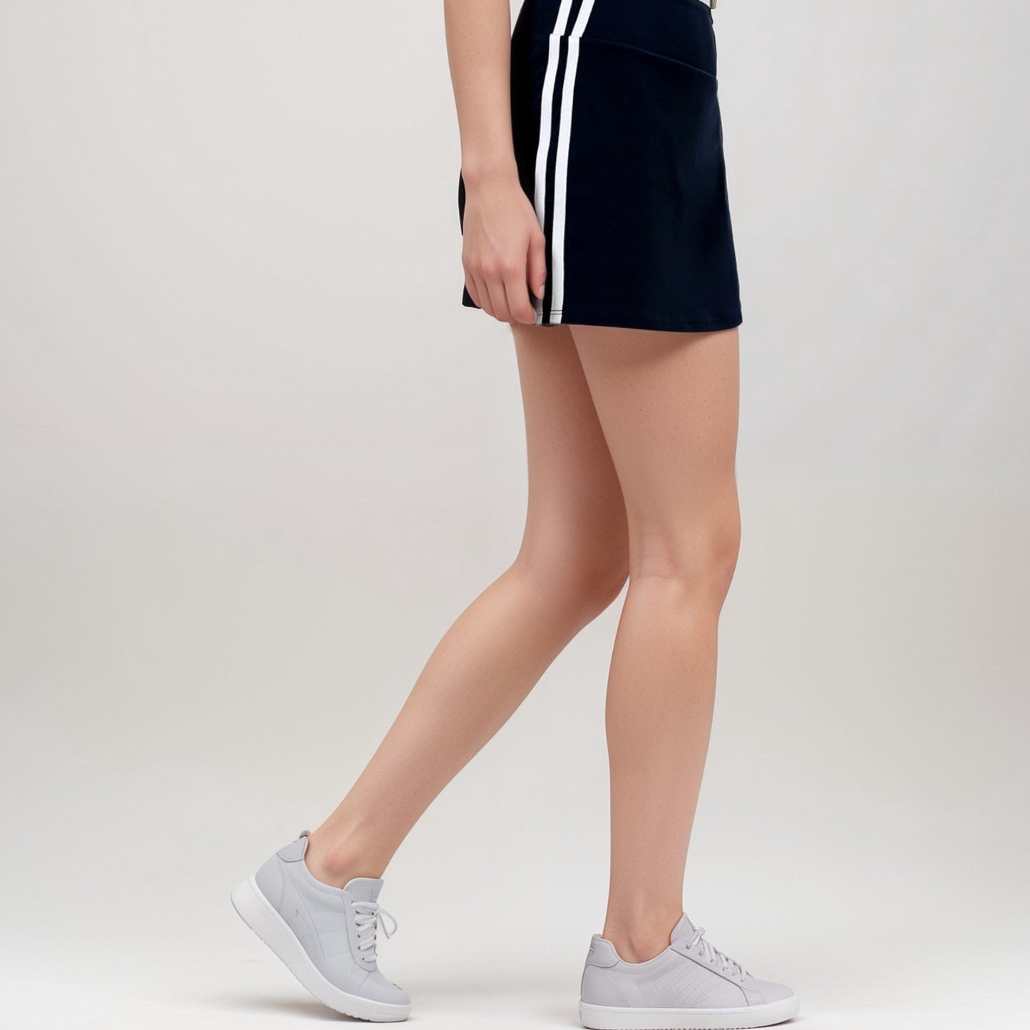 Active Women's Athletic Mini Skirt with Contrast Side Stripes and Built-In Shorts for Support