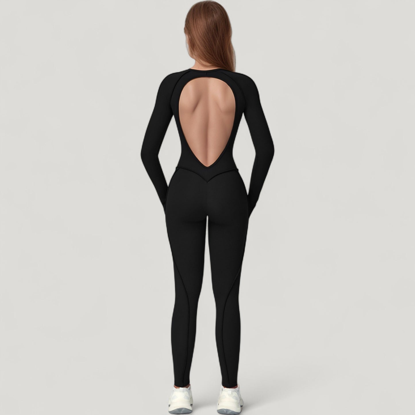 Long Sleeve Fitted One-Piece Activewear Jumpsuit with Contoured Stitching and Open Back Design