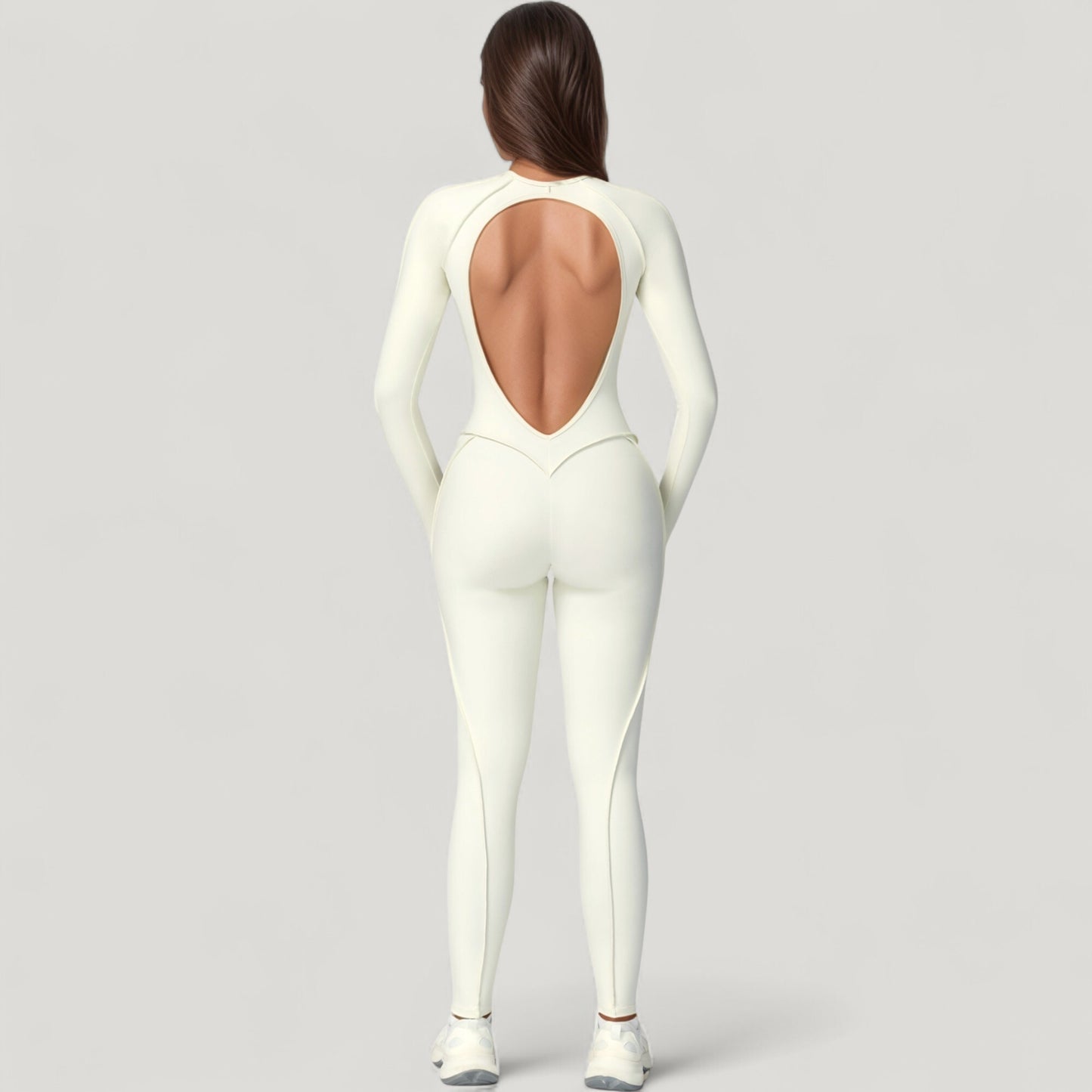 Long Sleeve Fitted One-Piece Activewear Jumpsuit with Contoured Stitching and Open Back Design