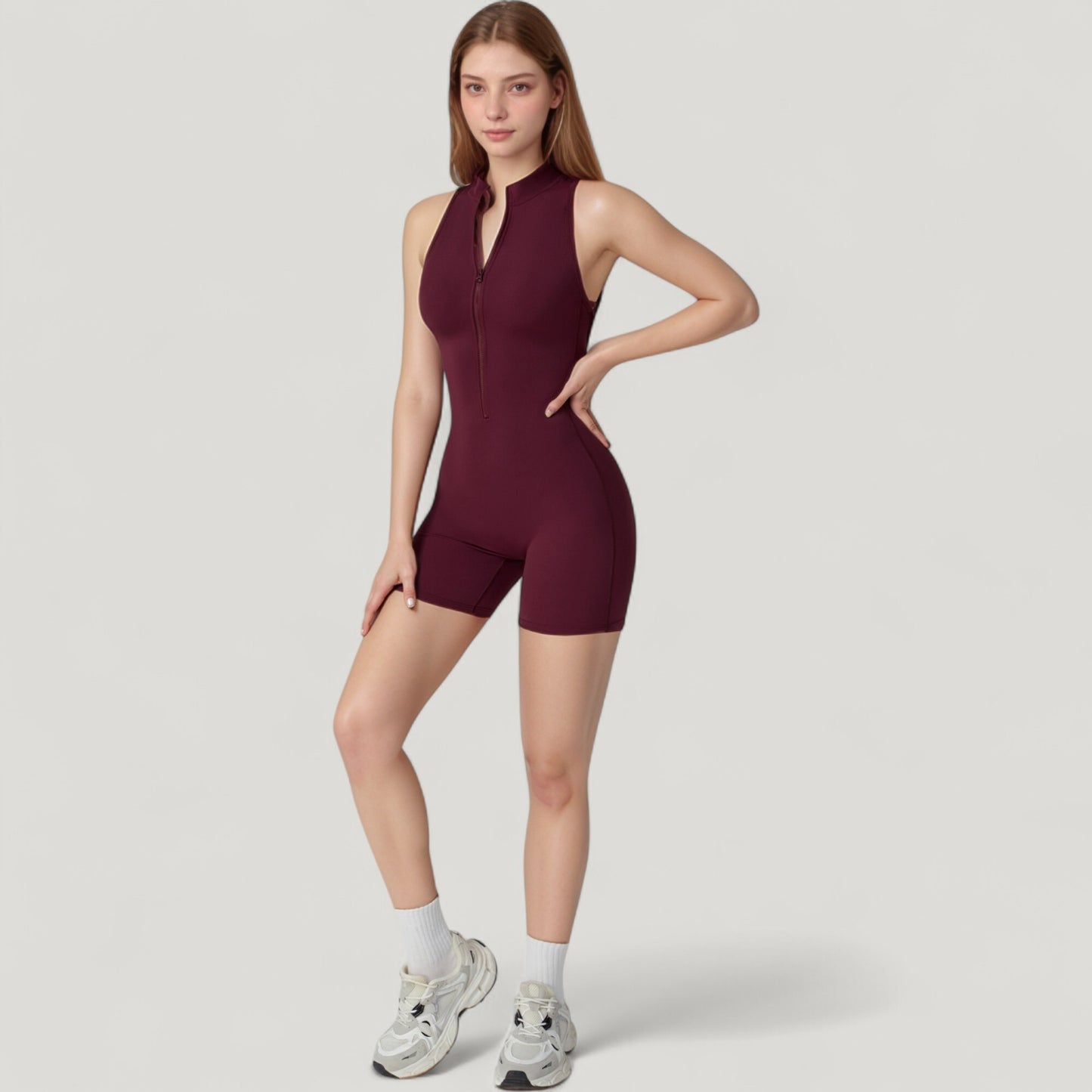 Sleeveless Zip Front Activewear Romper with Open Back and Contoured Fit