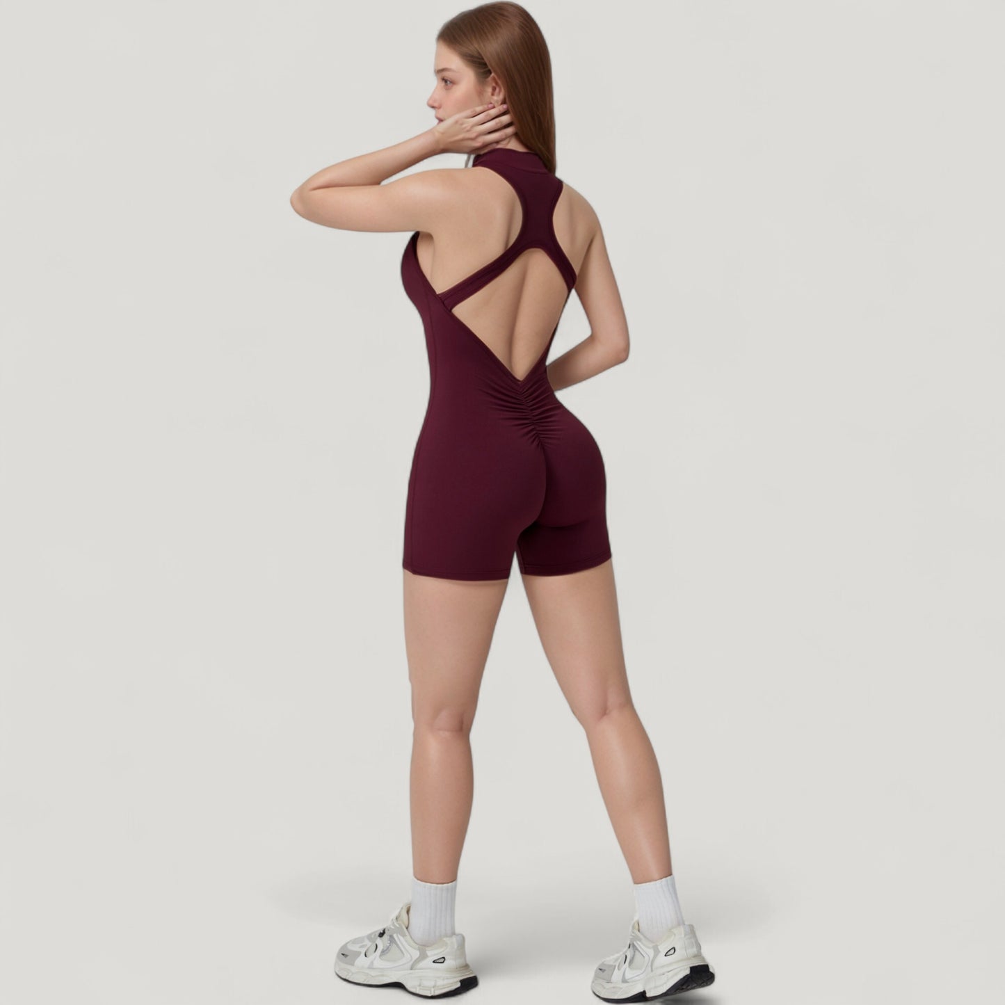 Sleeveless Zip Front Activewear Romper with Open Back and Contoured Fit