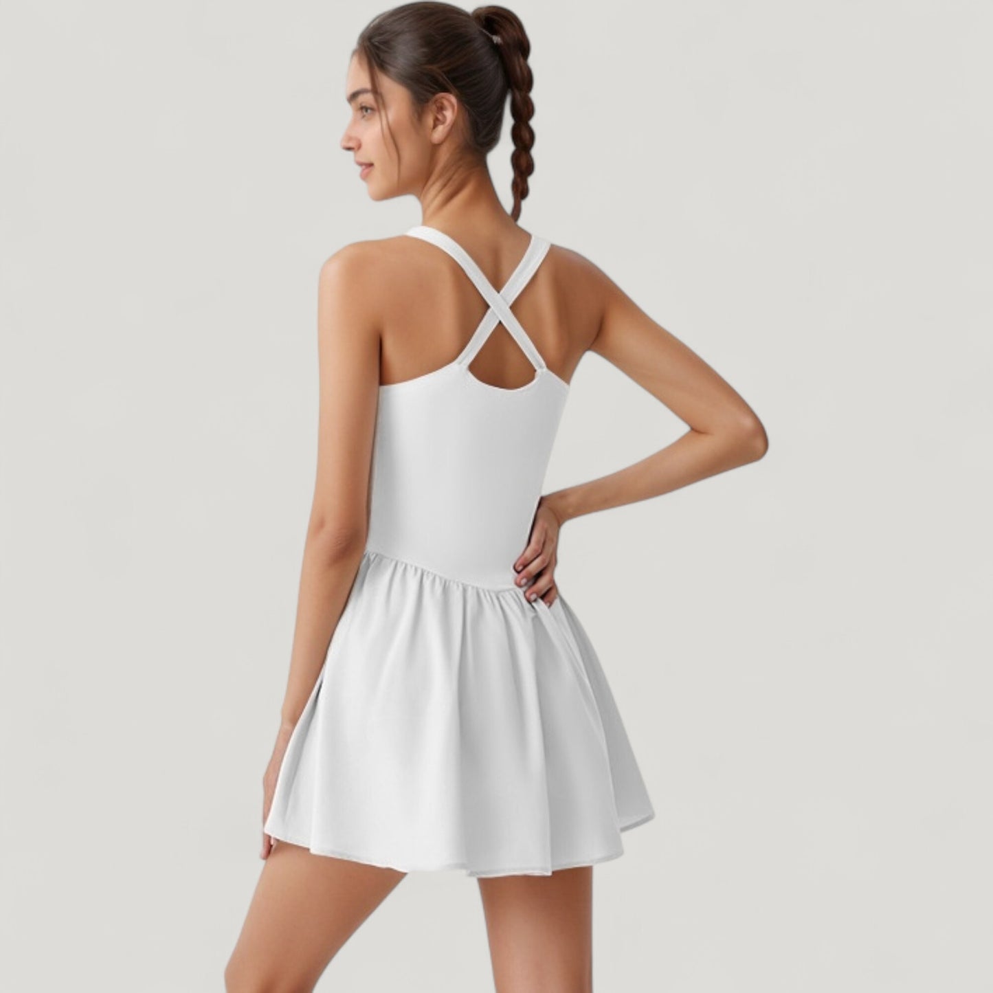 Sleeveless Active Tennis Dress with Flowy Skirt and Crisscross Back Strap Detail