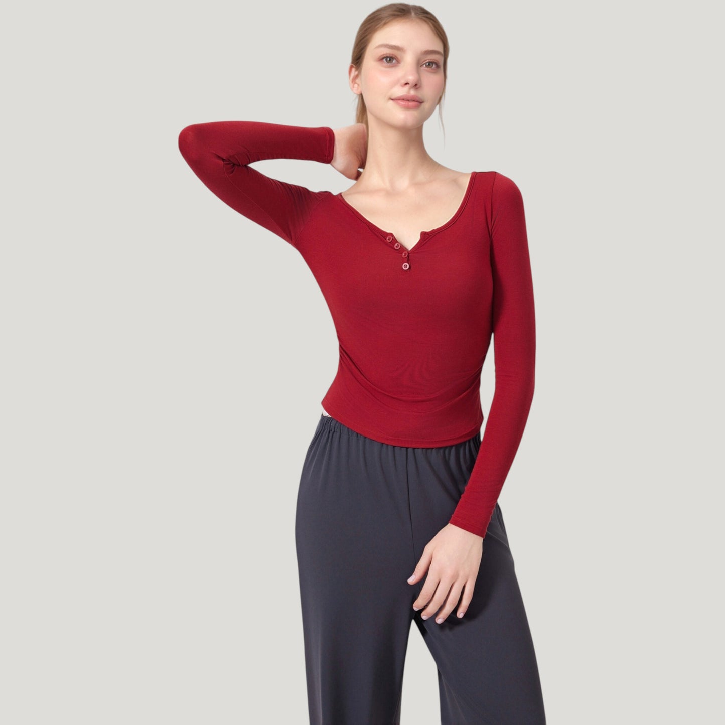 Long Sleeve Henley Activewear Top with Scoop Neckline and Streamlined Fitted Silhouette