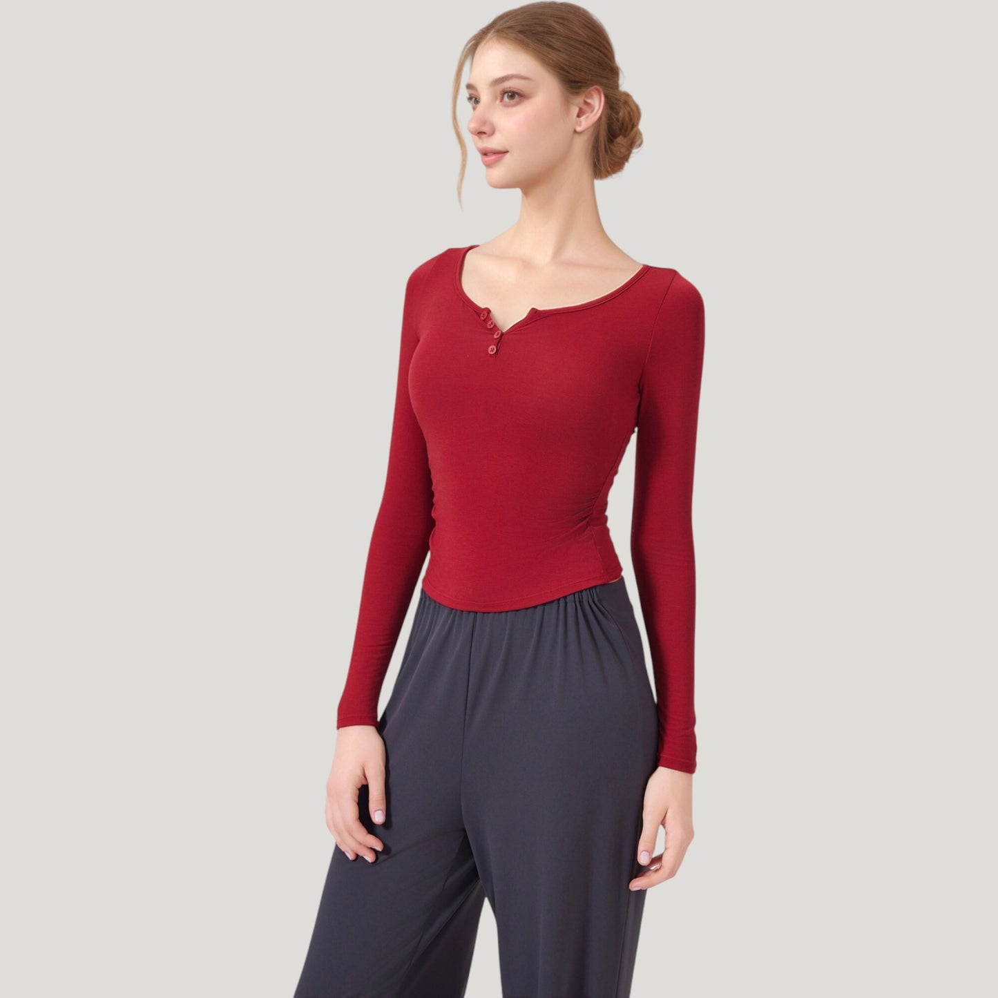 Long Sleeve Henley Activewear Top with Scoop Neckline and Streamlined Fitted Silhouette
