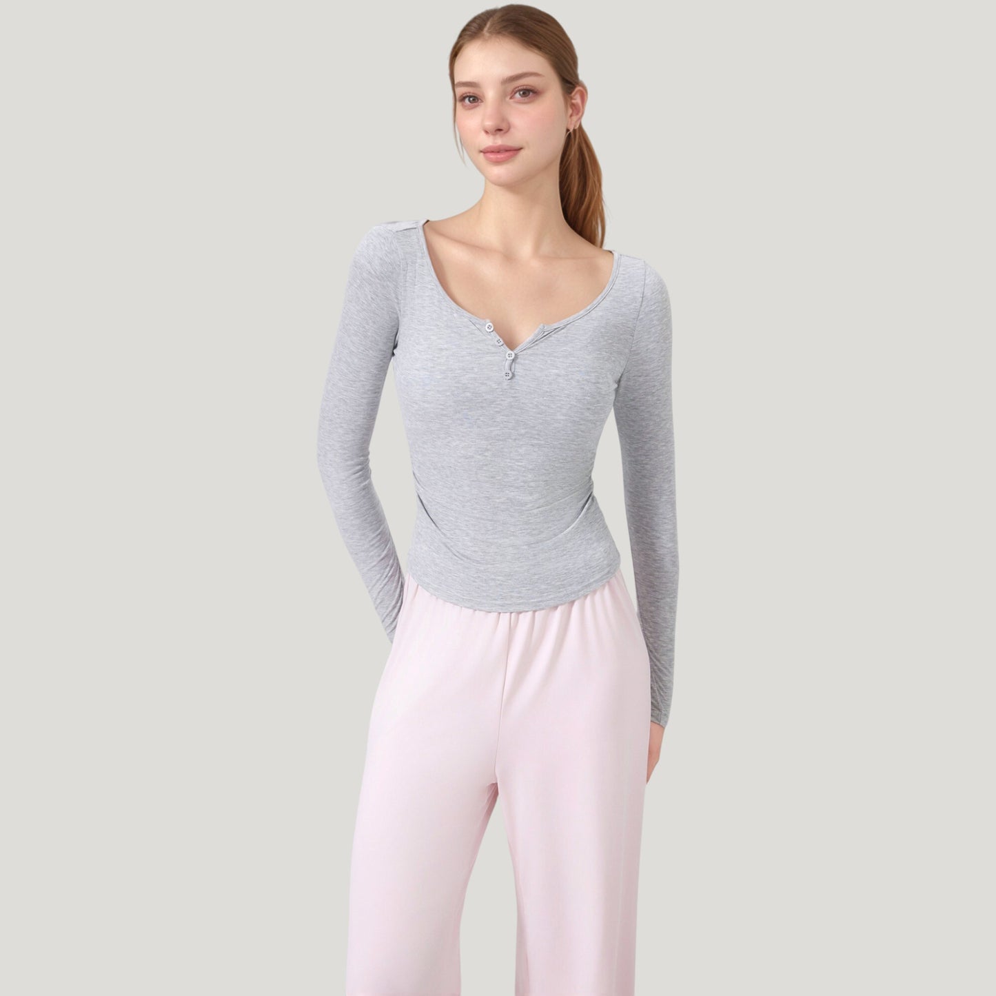 Long Sleeve Henley Activewear Top with Scoop Neckline and Streamlined Fitted Silhouette