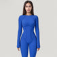 Long Sleeve Fitted One-Piece Activewear Jumpsuit with Contoured Stitching and Open Back Design