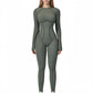 Long Sleeve Fitted One-Piece Activewear Jumpsuit with Contoured Stitching and Open Back Design