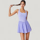 Sleeveless Active Tennis Dress with Flowy Skirt and Crisscross Back Strap Detail