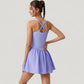 Sleeveless Active Tennis Dress with Flowy Skirt and Crisscross Back Strap Detail