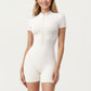 Short Sleeve Fitted Active Romper with Front Half Zip and Stretch One-Piece Design