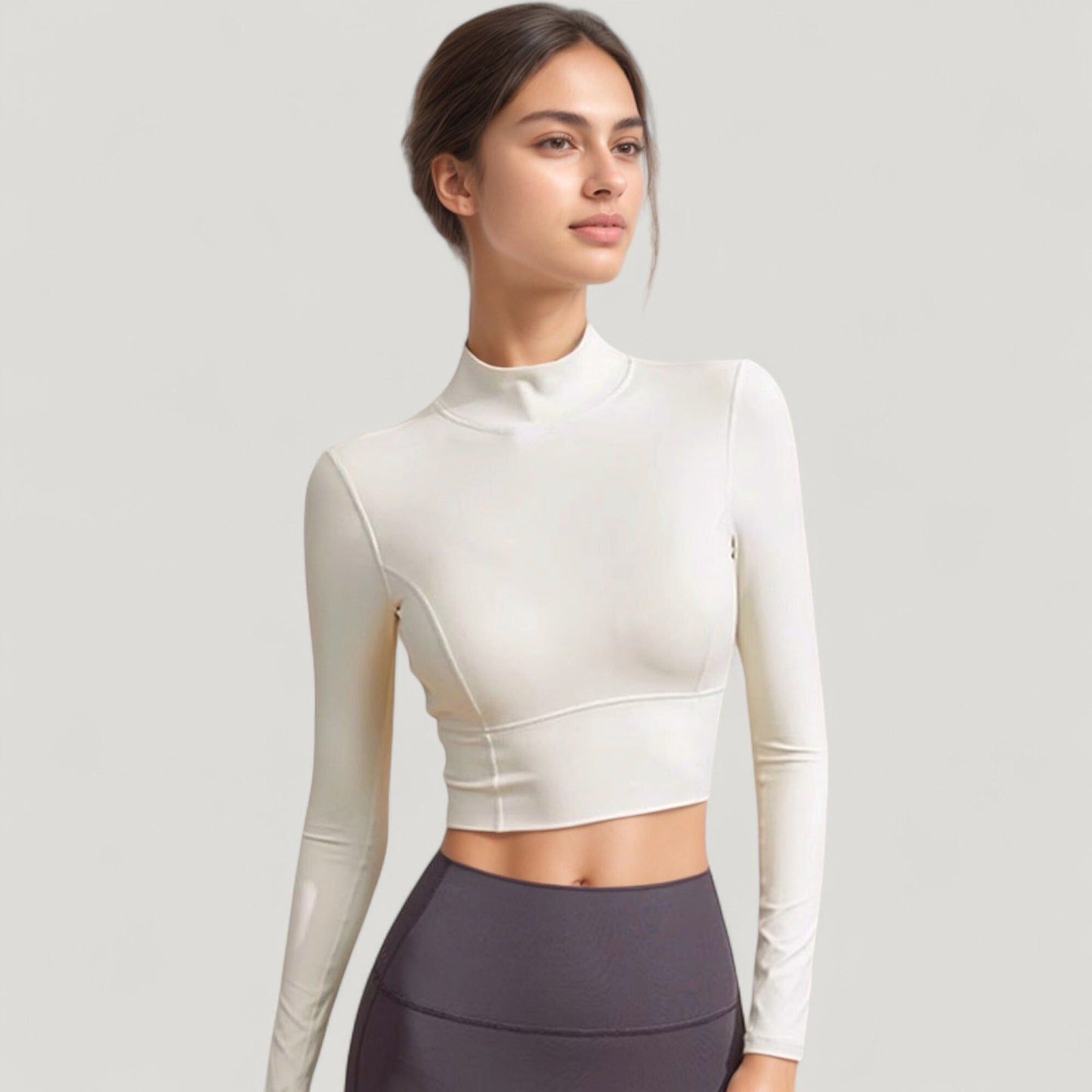 Long Sleeve Crop Top with High Neck and Open Back Design