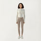 Long Sleeve Ribbed Knit Half Zip Top with Curved Hem and Fitted Silhouette