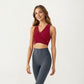 Sleeveless Wrap Front Crop Top with Deep V-Neckline and Twisted Hem Detail