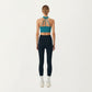 Sleeveless Wrap Front Crop Top with Deep V-Neckline and Twisted Hem Detail