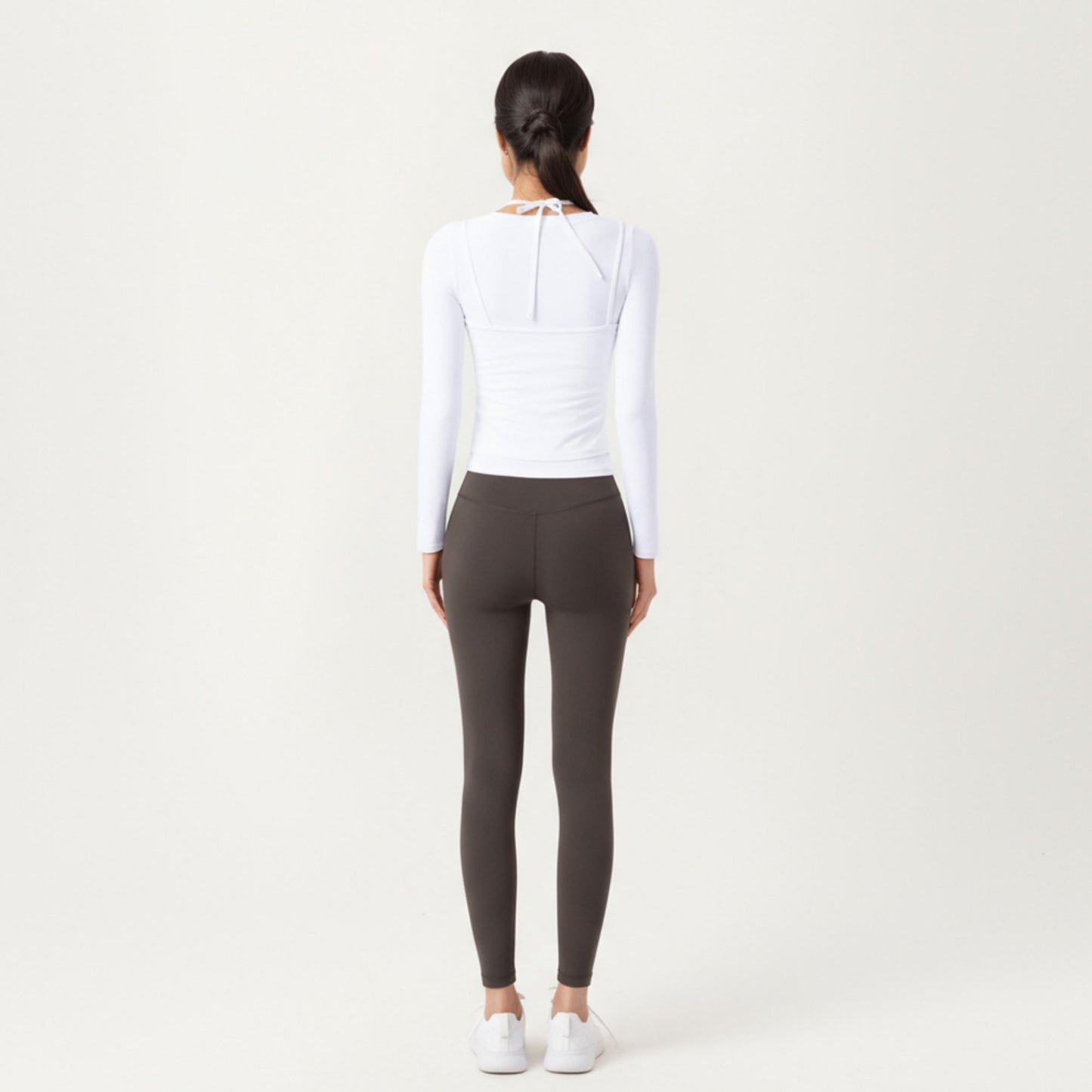 Long Sleeve Active Top with Layered Strap Detail Slim Contoured Fit and Modern Minimal Silhouette