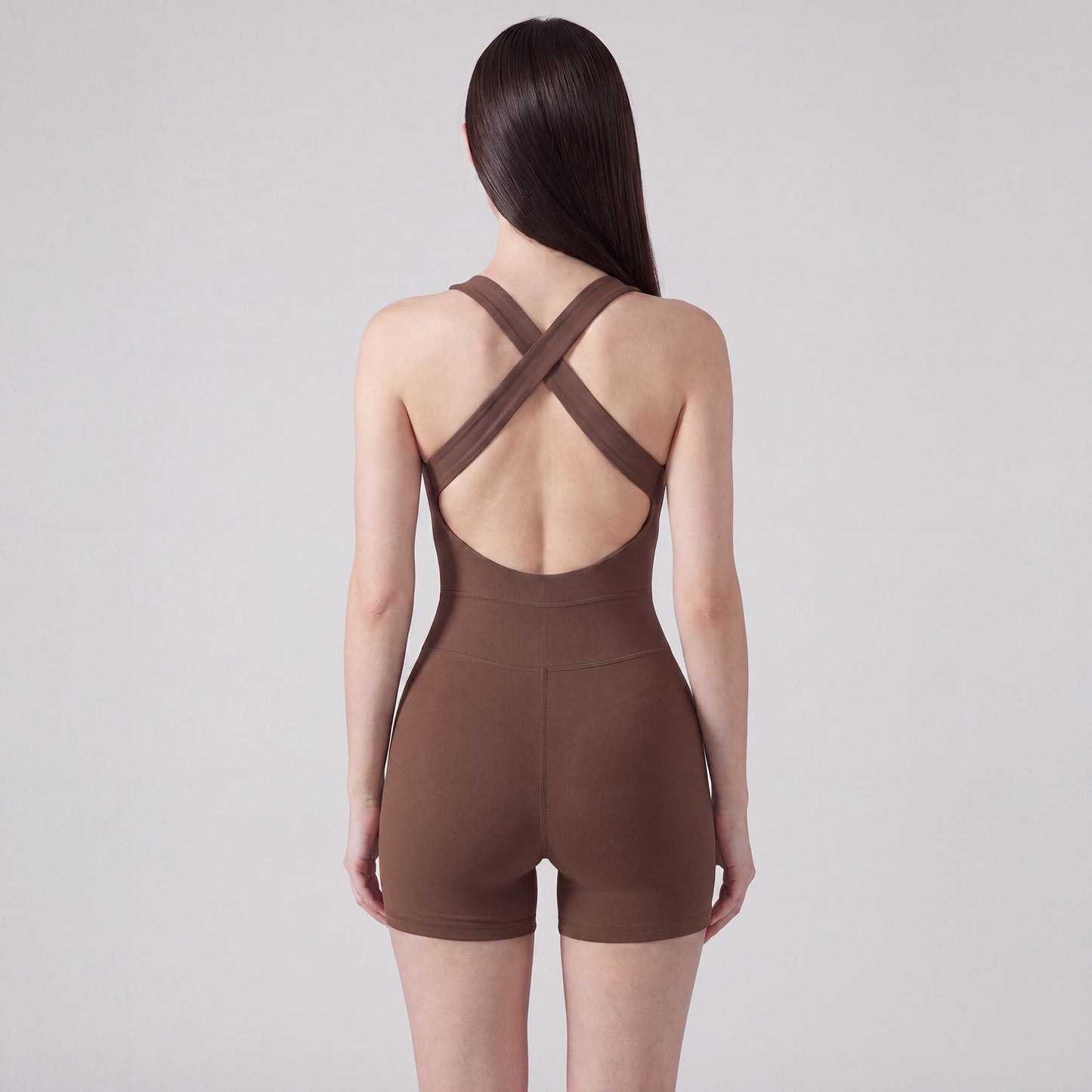 Sleeveless Active Romper with Cross Back Straps Ruched Bust Contour Seams and Fitted Shorts