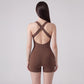 Sleeveless Active Romper with Cross Back Straps Ruched Bust Contour Seams and Fitted Shorts