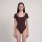 Short Sleeve One Piece Active Bodysuit with Built In Padding Open Back Stretch Fit and Quick Dry Fabric