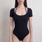 Short Sleeve One Piece Active Bodysuit with Built In Padding Open Back Stretch Fit and Quick Dry Fabric