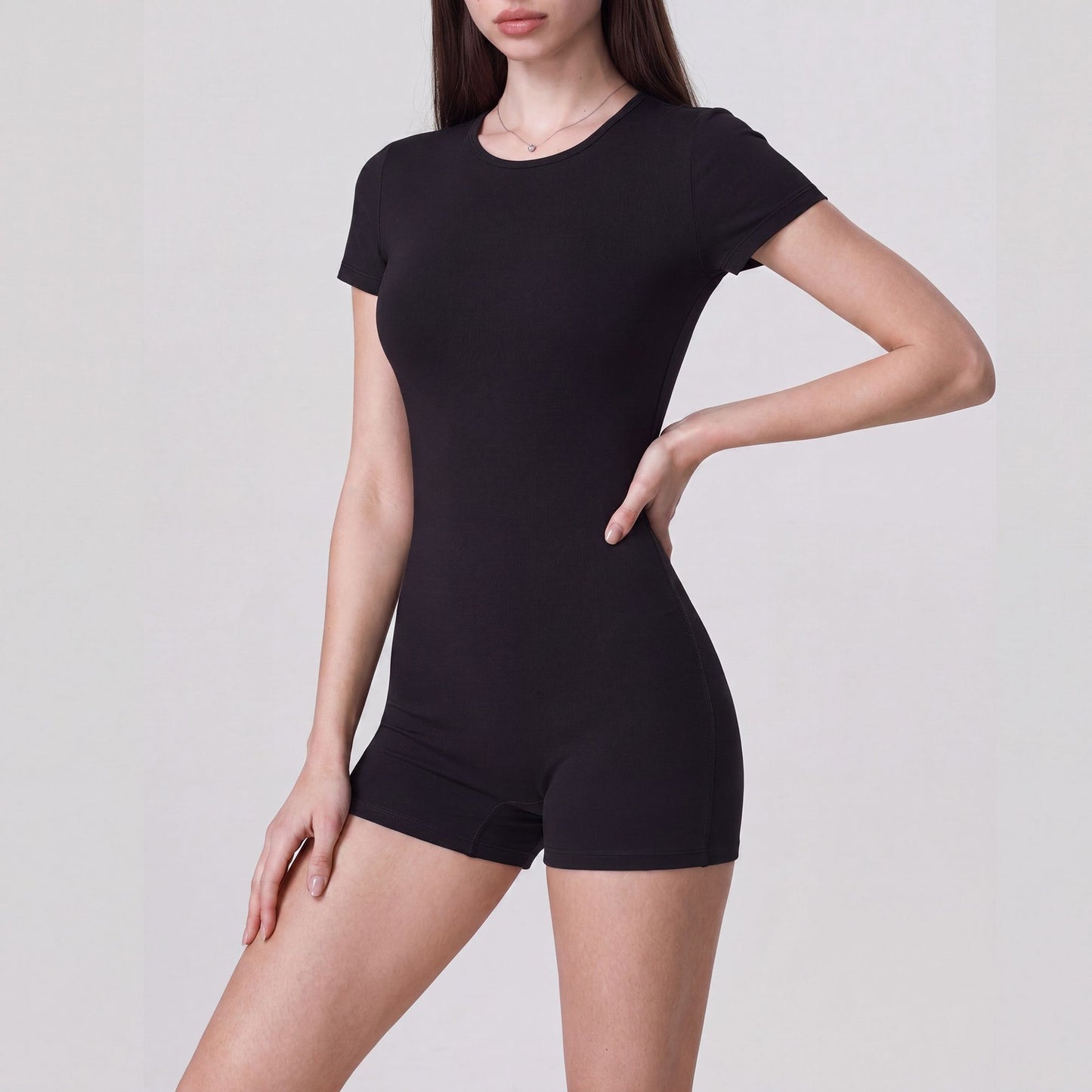 Short Sleeve One Piece Active Romper with Crew Neck Built In Padding Fitted Shorts and Smooth Stretch Fabric