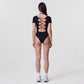 Short Sleeve One Piece Active Bodysuit with Built In Padding Open Back Stretch Fit and Quick Dry Fabric