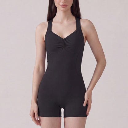 Sleeveless Active Romper with Cross Back Straps Ruched Bust Contour Seams and Fitted Shorts