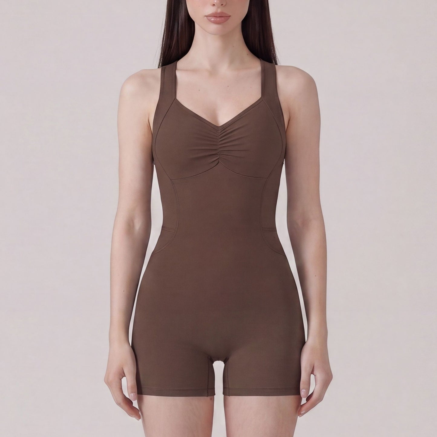 Sleeveless Active Romper with Cross Back Straps Ruched Bust Contour Seams and Fitted Shorts