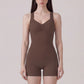 Sleeveless Active Romper with Cross Back Straps Ruched Bust Contour Seams and Fitted Shorts